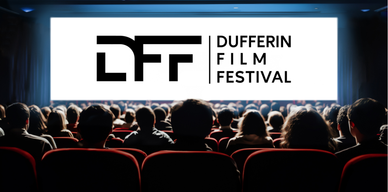 An audience watches a movie in a theatre. The screen has the logo for the Dufferin Film Festival.